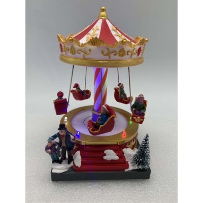 VILLA NAVIDAD CARRUSEL CON LUZ-MOVIMIENTO-MUSICA A BATERIA 18.5 cm x 12 cm x 13 cm